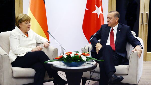 Turkish President Recep Tayyip Erdogan (R) meets German Chancellor Angela Merkel (L) during the G20 Summit in Antalya, on November 16, 2015 - Sputnik International