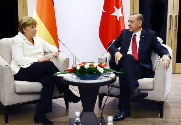 Turkish President Recep Tayyip Erdogan (R) meets German Chancellor Angela Merkel (L) during the G20 Summit in Antalya, on November 16, 2015 Turkish President Recep Tayyip Erdogan (R) meets German Chancellor Angela Merkel (L) during the G20 Summit in Antalya, on November 16, 2015 - Sputnik International