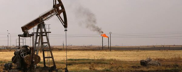 Oil well pumps are seen in the Rmeilane oil field in Syria's northerneastern Hasakeh province Oil well pumps are seen in the Rmeilane oil field in Syria's northerneastern Hasakeh province - Sputnik International