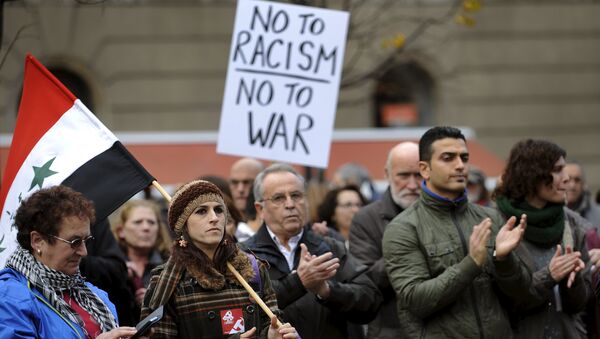 People attend a rally held in one of over 20 Spanish cities under the slogan Not In My Name, to protest against militant attacks and war, in Gijon, northern Spain, November 28, 2015. - Sputnik International