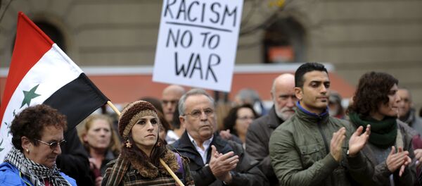 People attend a rally held in one of over 20 Spanish cities under the slogan Not In My Name, to protest against militant attacks and war, in Gijon, northern Spain, November 28, 2015. - Sputnik International