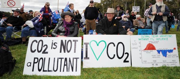 Anti-carbon tax protesters known as The Convoy of No Confidence listen to speeches in front of Parliament House in Canberra (file photo) Anti-carbon tax protesters known as The Convoy of No Confidence listen to speeches in front of Parliament House in Canberra (file photo) - Sputnik International