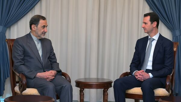 In this file photo released on Tuesday, May 19, 2015 by the Syrian official news agency SANA, Syrian President Bashar Assad, right, meets with Ali Akbar Velayati, an adviser to Iran's Supreme Leader Ayatollah Ali Khamenei, in Damascus, Syria. - Sputnik International