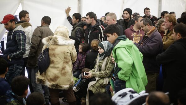 Migrants wait for registration at the central registration center for refugees and asylum seekers in Berlin - Sputnik International