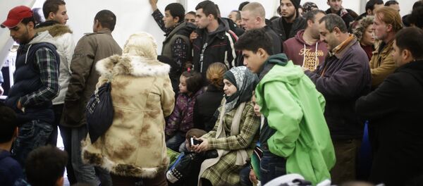 Migrants wait for registration at the central registration center for refugees and asylum seekers in Berlin - Sputnik International