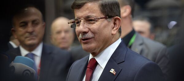 Turkish Prime Minister Ahmet Davutoglu speaks to the press as he arrives for a summit on relations between the European Union and Turkey and on the migration crisis at the EU headquarters in Brussels on November 29, 2015. - Sputnik International
