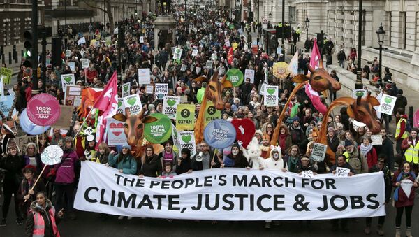 Protesters demonstrate during a rally held the day before the start of the Paris Climate Change Summit, in London, Britain November 29, 2015 - Sputnik International