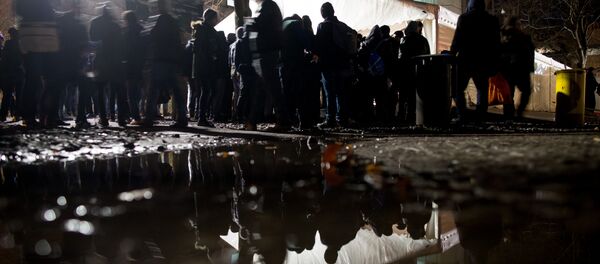 Asylum seekers wait for their registration in front of the State Office of Health and Social Affairs in Berlin (LAGeSo) in Berlin on November 30. 2015 Asylum seekers wait for their registration in front of the State Office of Health and Social Affairs in Berlin (LAGeSo) in Berlin on November 30. 2015 - Sputnik International