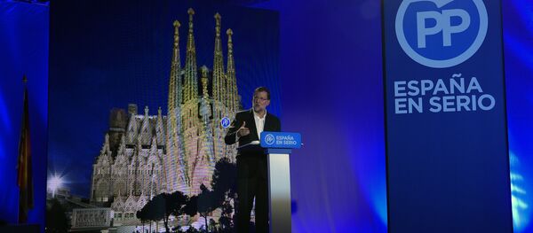 Spanish Prime Minister Mariano Rajoy (C) speaks during the presentation of the Popular Party (PP) candidates for the upcoming December 20 general election, in Barcelona on November 9, 2015 Spanish Prime Minister Mariano Rajoy (C) speaks during the presentation of the Popular Party (PP) candidates for the upcoming December 20 general election, in Barcelona on November 9, 2015 - Sputnik International