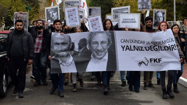 This file photo shows people demonstrating against the jailing of opposition Cumhuriyet newspaper's editor-in-chief Can Dundar and Ankara representative Erdem Gul, in Ankara, Turkey, Friday, Nov. 27, 2015 - Sputnik International