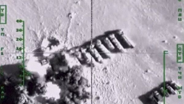 Oil trucks, which, according to Russia's Defence Ministry, are being used by Islamic State militants, are hit by air strikes carried out by Russia's air force, at an unknown location in Syria, in this still image taken from video footage released by Russia's Defence Ministry on November 18, 201 - Sputnik International