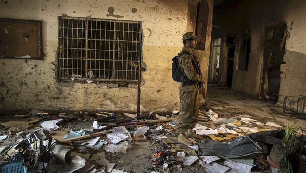 An army soldier stands in the Army Public School, which was attacked by Taliban gunmen, in Peshawar, in this December 17, 2014 file photo - Sputnik International