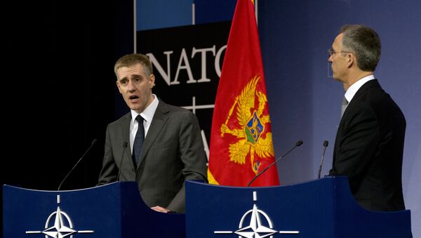 NATO Secretary General Jens Stoltenberg, right, and Montenegro's Foreign Minister Igor Luksic address a media conference at NATO headquarters in Brussels on Wednesday, Dec. 2, 2015 - Sputnik International