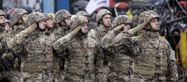 Soldiers from the Latvian army salute as they march during Independence Day military parade in Riga, Latvia, November 18, 2015 - Sputnik International