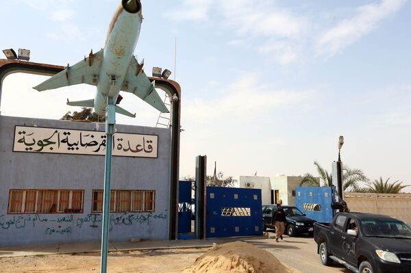 Members of forces loyal to Libya's Islamist-backed parliament General National Congress (GNC) secure the Al-Ghardabiya airbase as they fight Islamic State (IS) group jihadists on the outskirts of Libya's western city of Sirte on March 16, 2015 Members of forces loyal to Libya's Islamist-backed parliament General National Congress (GNC) secure the Al-Ghardabiya airbase as they fight Islamic State (IS) group jihadists on the outskirts of Libya's western city of Sirte on March 16, 2015 - Sputnik International