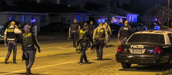 Authorities guard the perimeter near the location of an officer-involved shooting Wednesday, Dec. 2, 2015, in San Bernardino, Calif., following a shooting that killed multiple people at a social services center for the disabled - Sputnik International