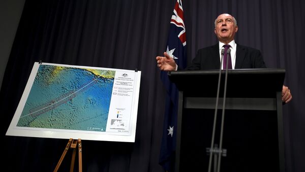 Australia's Deputy Prime Minister Warren Truss speaks during a media conference next to a map displaying the search area for missing Malaysia Airlines Flight MH370 at Parliament House in Canberra, Australia, December 3, 2015 - Sputnik International