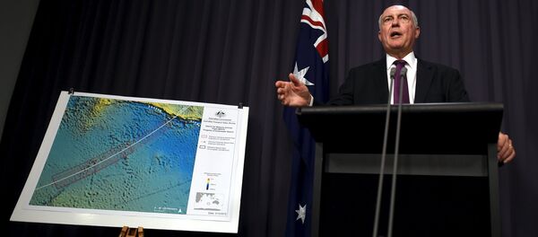 Australia's Deputy Prime Minister Warren Truss speaks during a media conference next to a map displaying the search area for missing Malaysia Airlines Flight MH370 at Parliament House in Canberra, Australia, December 3, 2015 - Sputnik International
