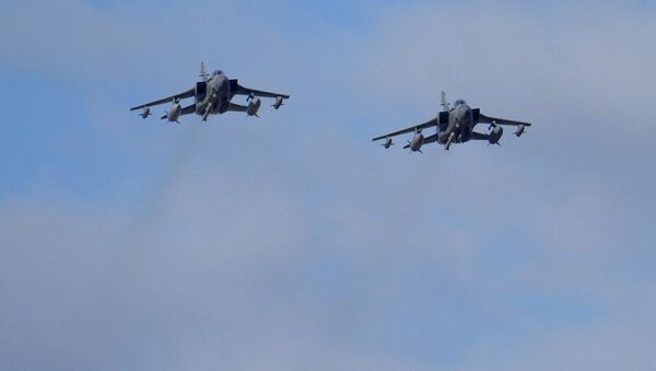 Two British Tornados warplanes fly over the RAF Akrotiri, a British air base near costal city of Limassol, Cyprus, Thursday, Dec. 3, 2015, as they arrive from an airstrike against Islamic State group targets in Syria - Sputnik International