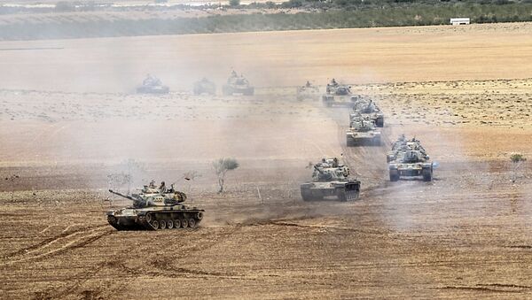 Turkish army tanks take position near the Syrian border in Suruc after three mortars hit the Turkish side. File photo. - Sputnik International