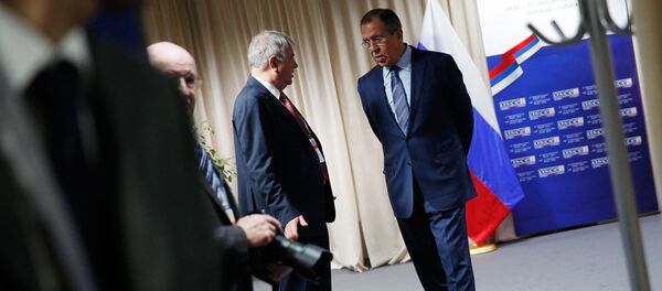 Russian Foreign Minister Sergei Lavrov (R) waits to greet the US Secretary of State prior to a bilateral meeting alongside the annual Organization for Security and Cooperation in Europe (OSCE) Ministerial Council meeting in Belgrade on December 3, 2015 Russian Foreign Minister Sergei Lavrov (R) waits to greet the US Secretary of State prior to a bilateral meeting alongside the annual Organization for Security and Cooperation in Europe (OSCE) Ministerial Council meeting in Belgrade on December 3, 2015 - Sputnik International