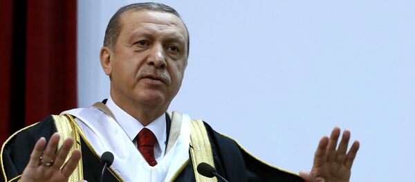 Turkey's President Recep Tayyip Erdogan addresses after he received an honorary doctorate from Qatar University in Doha, Qatar, Wednesday, Dec. 2, 2015 - Sputnik International