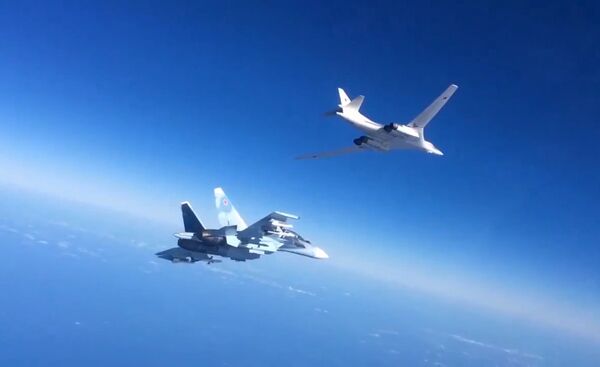 Russian Aerospace Defense Forces' Su-30SM fighter escorts a Tu-160 bomber which fired cruise missiles at Daesh targets in Syria. Still from video published by the Russian Defense Ministry. Russian Aerospace Defense Forces' Su-30SM fighter escorts a Tu-160 bomber which fired cruise missiles at Daesh targets in Syria. Still from video published by the Russian Defense Ministry. - Sputnik International