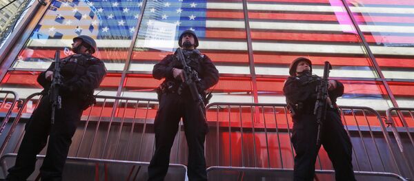 Heavily armed New York city police officers with the Strategic Response Group stand guard at the armed forces recruiting center in New York's Times Square, Saturday, Nov. 14, 2015 Heavily armed New York city police officers with the Strategic Response Group stand guard at the armed forces recruiting center in New York's Times Square, Saturday, Nov. 14, 2015 - Sputnik International