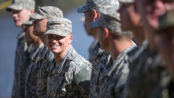 Maj. Lisa Jaster, center, stands in formation with other Rangers during an Army Ranger school graduation ceremony, Friday, Oct. 16, 2015, in Fort Benning, Ga. - Sputnik International