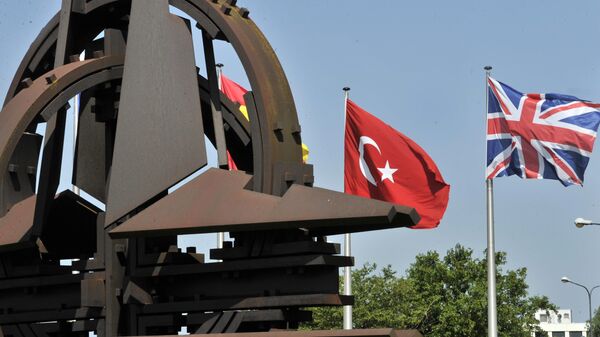 A Turkish and an Union Jack flags are pictured at the NATO Headquarters in Brussels - Sputnik International