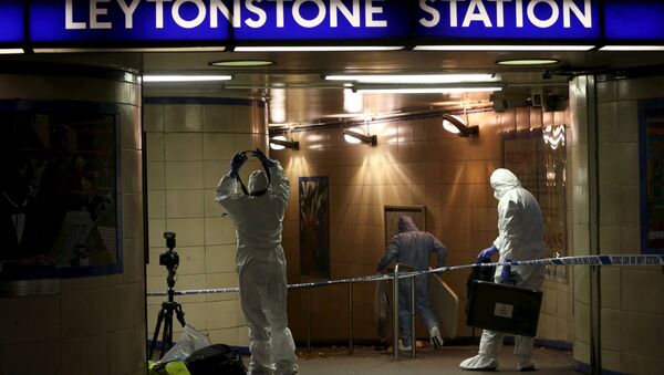 Police officers investigate a crime scene at Leytonstone underground station in east London - Sputnik International