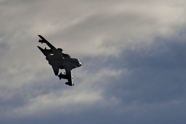 A British Tornado warplane flies over the RAF Akrotiri, a British air base near costal city of Limassol, Cyprus, Thursday, Dec. 3, 2015, after arriving from an airstrike against Islamic State group targets in Syria - Sputnik International