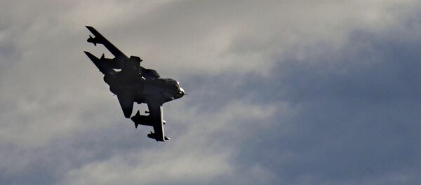 A British Tornado warplane flies over the RAF Akrotiri, a British air base near costal city of Limassol, Cyprus, Thursday, Dec. 3, 2015, after arriving from an airstrike against Islamic State group targets in Syria - Sputnik International