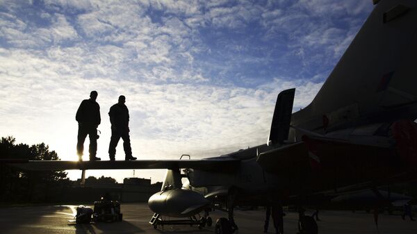 Pilots and ground crew prepare a Tornado GR4 aircraft at the British Royal Air Force airbase RAF Marham in Norfolk in east England on December 2, 2015 - Sputnik International
