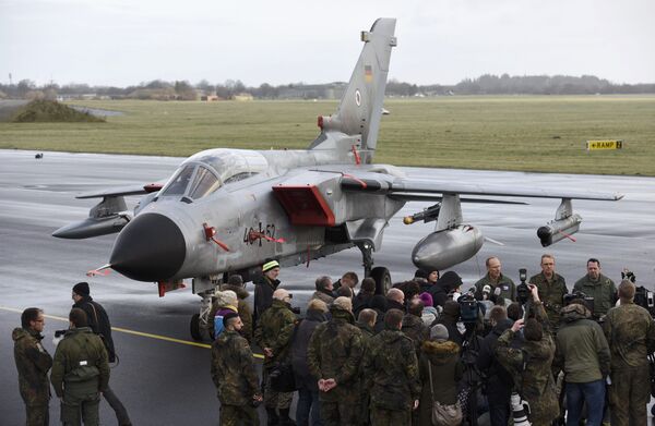 Journalists stand in front of a Tornado aircraft of the Tactical Air Force Wing 51 'Immelmann' during a presentation at German army Bundeswehr airbase in Jagel near the German-Danish border, December 4, 2015 Journalists stand in front of a Tornado aircraft of the Tactical Air Force Wing 51 'Immelmann' during a presentation at German army Bundeswehr airbase in Jagel near the German-Danish border, December 4, 2015 - Sputnik International