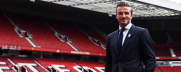 Former Manchester United and England footballer David Beckham poses on the pitch at Old Trafford in Manchester, north west England on October 6, 2015 ahead of a charity football match in aid of UNICEF Former Manchester United and England footballer David Beckham poses on the pitch at Old Trafford in Manchester, north west England on October 6, 2015 ahead of a charity football match in aid of UNICEF - Sputnik International