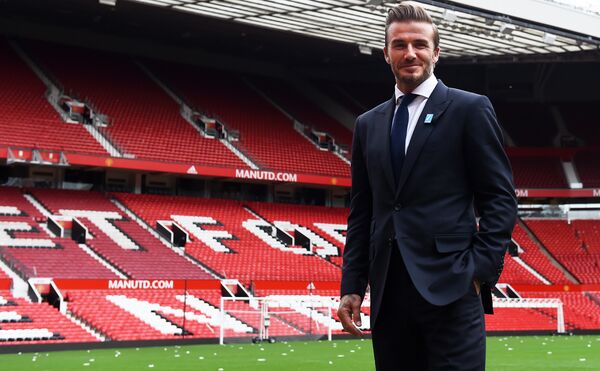 Former Manchester United and England footballer David Beckham poses on the pitch at Old Trafford in Manchester, north west England on October 6, 2015 ahead of a charity football match in aid of UNICEF Former Manchester United and England footballer David Beckham poses on the pitch at Old Trafford in Manchester, north west England on October 6, 2015 ahead of a charity football match in aid of UNICEF - Sputnik International