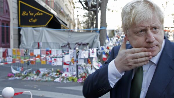 London Mayor Boris Johnson leaves after placing flowers at the Bataclan concert hall to pay tribute to the shooting victims in Paris, France, December 3, 2015. - Sputnik International
