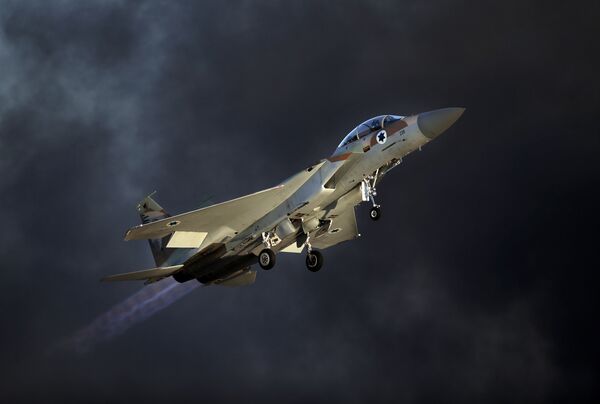 An Israeli F-15 E fighter jet takes off during an air show. An Israeli F-15 E fighter jet takes off during an air show. - Sputnik International