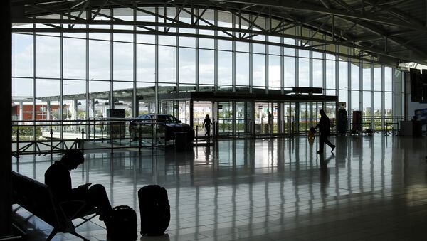A passenger waits for his flight at Larnaca international airport, Larnaca, Cyprus. (File) - Sputnik International