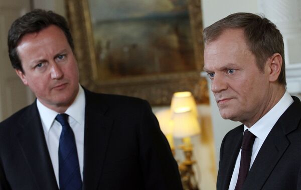 Britain's Prime Minister David Cameron, left, listens to European Council President Donald Tusk. Britain's Prime Minister David Cameron, left, listens to European Council President Donald Tusk. - Sputnik International