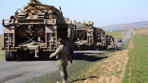 Turkish Army vehicles and tanks move near the Syrian border in Suruc on February 23, 2015 - Sputnik International
