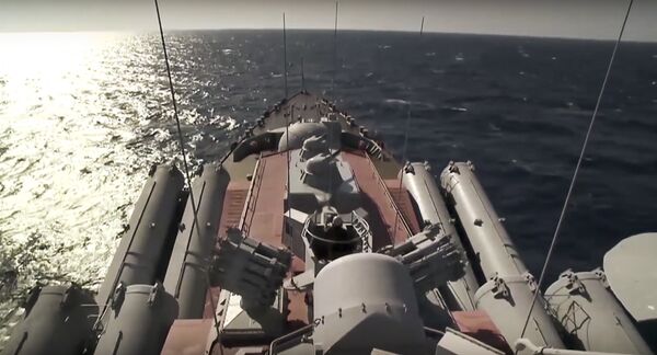 In this photo made from the footage taken from Russian Defense Ministry official web site on Friday, Nov. 27, 2015, the Russian missile cruiser Moskva cruises near the shore of Syria’s province of Latakia, Syria - Sputnik International