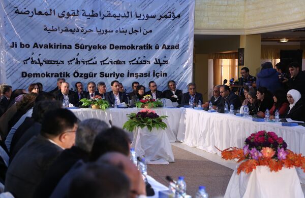 A picture taken on December 8, 2015 shows a general view of a meeting hosted by Syrian Kurdish factions in Al-Malikiyeh, a town in Syria's northeastern Hasakeh province, held to discuss a vision for Syria's future A picture taken on December 8, 2015 shows a general view of a meeting hosted by Syrian Kurdish factions in Al-Malikiyeh, a town in Syria's northeastern Hasakeh province, held to discuss a vision for Syria's future - Sputnik International