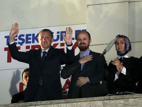 Turkey's President Recep Tayyip Erdogan, his son Bilal Erdogan and daughter Sumeyye Erdogan salute supporters from the balcony of his ruling party headquarters in Ankara. Turkey's President Recep Tayyip Erdogan, his son Bilal Erdogan and daughter Sumeyye Erdogan salute supporters from the balcony of his ruling party headquarters in Ankara. - Sputnik International