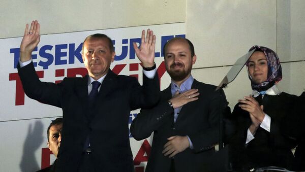 Turkey's Prime Minister Recep Tayyip Erdogan, his son Bilal Erdogan and daughter Sumeyye Erdogan salute supporters from the balcony of his ruling party headquarters in Ankara. - Sputnik International
