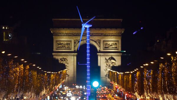 A power-generating windmill turbine is seen on the Champs Elysees avenue with the Arc de Triomphe in background as part of the COP21, United Nations Climate Change Conference, in Paris, Wednesday, Dec. 2, 2015 - Sputnik International