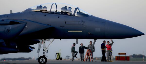In this image released by the US Air Force (USAF), an F-15E Strike Eagle prepares to depart RAF Lakenheath in the United Kingdom to support Operation Inherent Resolve, on November 12, 2015 - Sputnik International