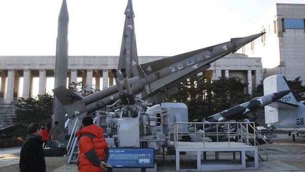 Visitors walk watch models of North Korea's Scud-B missile, left, and other South Korean missiles on display at Korea War Memorial Museum in Seoul, South Korea. Friday, Jan. 25, 2013 - Sputnik International