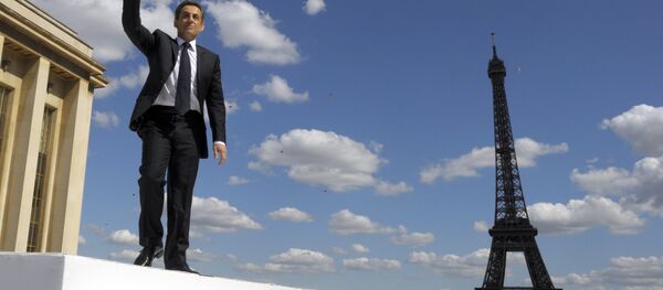 French President and conservative candidate for his re-election in the 2012 French presidential elections, Nicolas Sarkozy waves to supporters as he leaves the Trocadero square after delivering a speech during a campaign rally in front the Eiffel Tower in Paris, Tuesday May 1, 2012. - Sputnik International